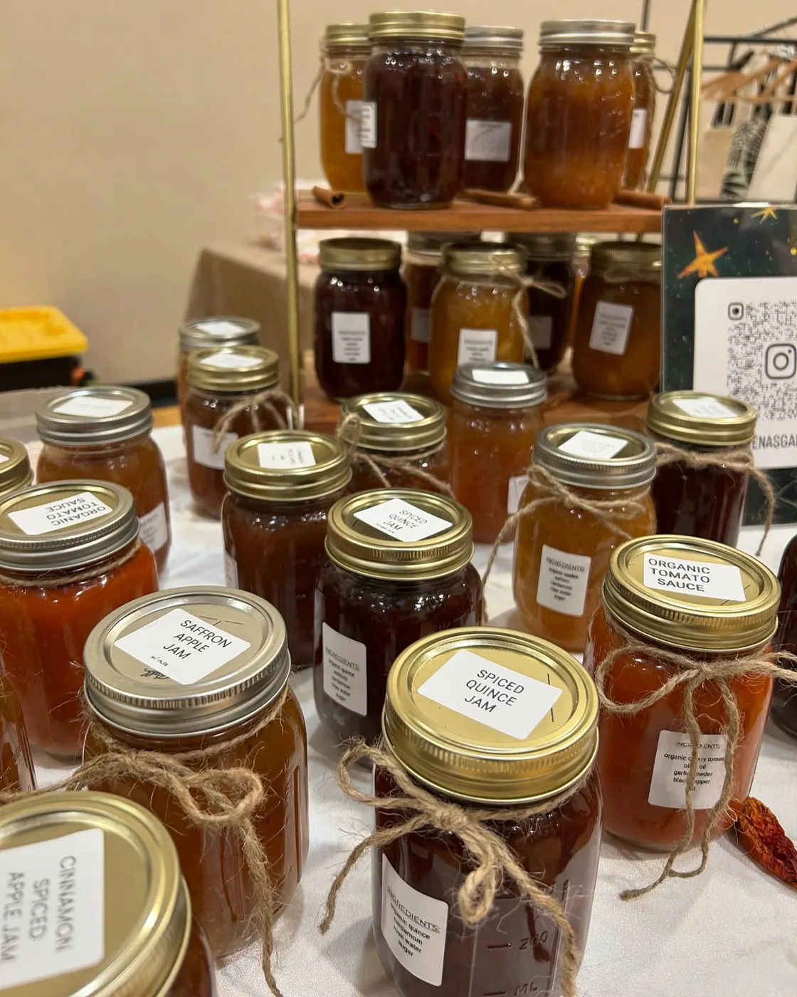 A display of assorted homemade jam and preserve jars