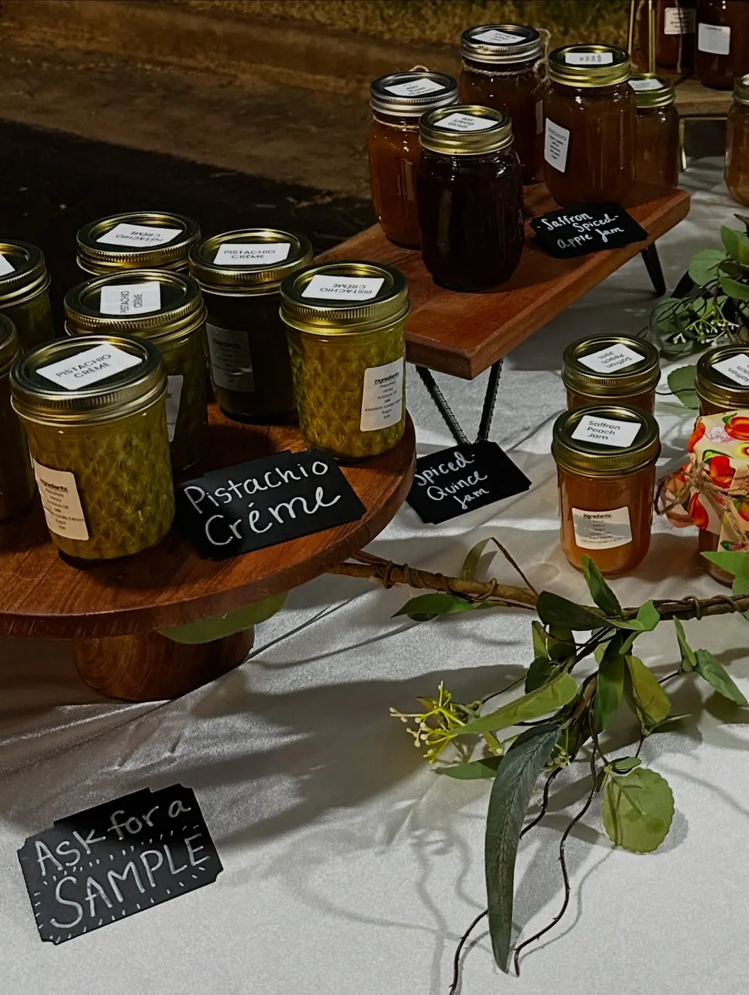 Small sample jars of homemade jams arranged for customers