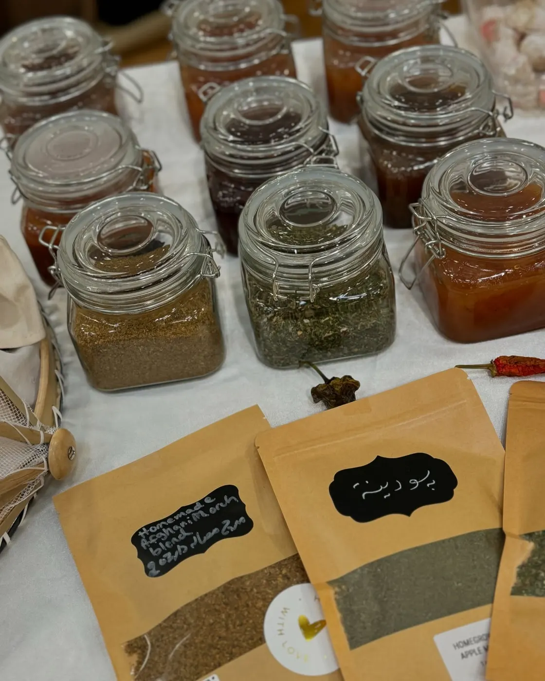 Jars and pouches of dried herbs and spice blends